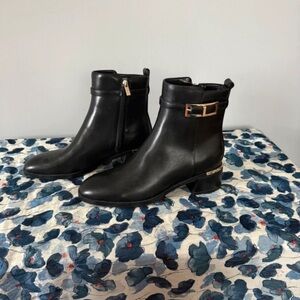 Women's Black Leather Ankle Booties with Gold Buckle Detail
